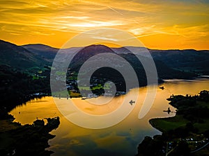 Aerial view of sunset over Ullswater lake in Lake District, a region and national park in Cumbria in northwest England