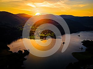 Aerial view of sunset over Ullswater lake in Lake District, a region and national park in Cumbria in northwest England