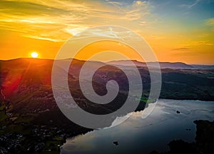 Aerial view of sunset over Ullswater lake in Lake District, a region and national park in Cumbria in northwest England