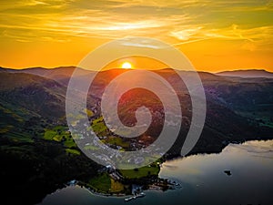 Aerial view of sunset over Ullswater lake in Lake District, a region and national park in Cumbria in northwest England