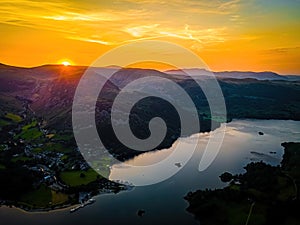 Aerial view of sunset over Ullswater lake in Lake District, a region and national park in Cumbria in northwest England