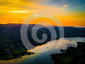 Aerial view of sunset over Ullswater lake in Lake District, a region and national park in Cumbria in northwest England