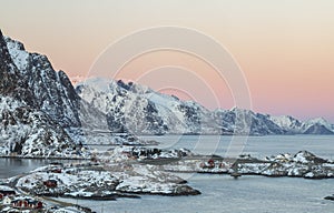 Aerial view during sunset over the winter mountain ranges of Mos