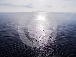 Aerial view of a Sunset sky background. Aerial Dramatic gold sunset sky with evening sky clouds over the sea. Stunning sky clouds