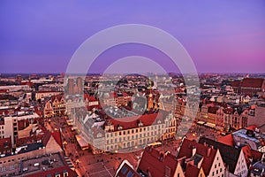 Aerial view of the sunset of Stare Miasto with Market Square, Old Town Hall and St. Elizabeth`s Church from St. Mary Magdalene