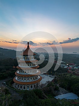 Aerial view of sunset at Wuji Tianyuan Temple by drone in Tamsui, New Taipei City, Taiwan.