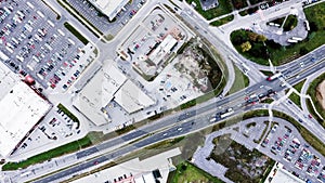 Aerial view of supermarkets, car parks and roads.