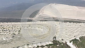 Aerial view of a surface tailings pond of chemical residue.