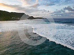 Aerial view of a surfer at Pacifico beach, Siargao, Philippines photo