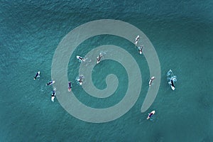 Aerial view of surfers in the ocean at the Baleal beach in Peniche