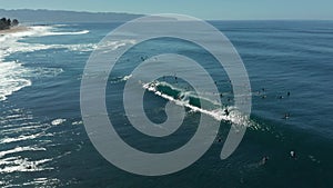 Aerial view of surfers in the water at Banzai Pipeline beach on North Shore of Oahu