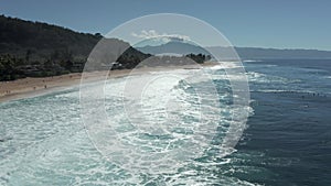 Aerial view of surfers in the water at Banzai Pipeline beach on North Shore of Oahu