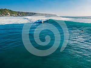 Aerial view of surfing on wave. Surfer on wave in ocean