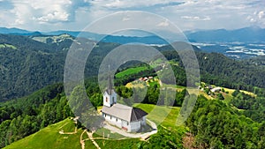 Aerial View of Sveti Jakob Hill with a Church on Top. Slovenia, Europe