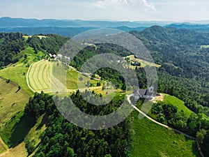 Aerial View of Sveti Jakob Hill with a Church on Top. Slovenia, Europe