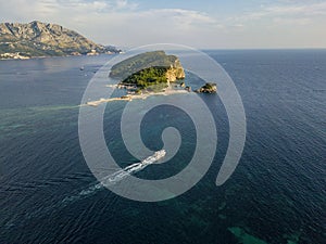 Aerial view of Sveti Nikola, Budva island, Montenegro. Jagged coasts with sheer cliffs overlooking the transparent sea