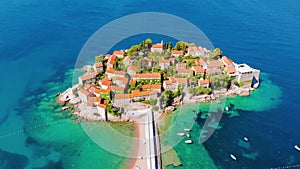 Aerial view of Sveti Stefan, island in Montenegro surrounded by Adriatic coast