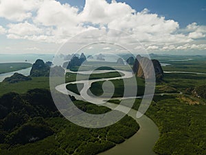 Aerial view of a swerving river through a series of limestones in Phang Nga Bay