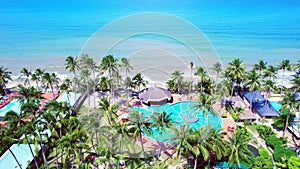 Aerial view of Swimming pool and the beach in the resort