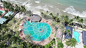 Aerial view of Swimming pool and the beach in the resort