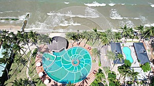 Aerial view of Swimming pool and the beach in the resort