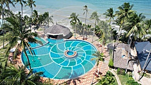 Aerial view of Swimming pool and the beach in the resort