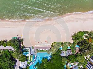 Aerial view of swimming pool with sea and beach