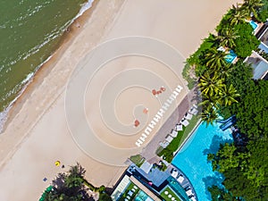 Aerial view of swimming pool with sea and beach