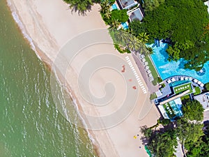 Aerial view of swimming pool with sea and beach