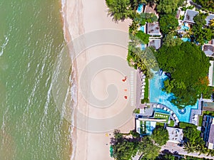 Aerial view of swimming pool with sea and beach