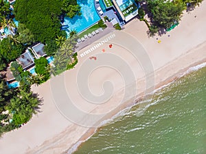 Aerial view of swimming pool with sea and beach