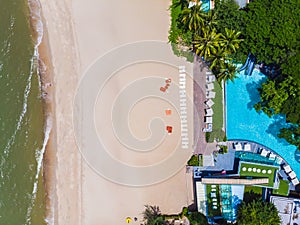 Aerial view of swimming pool with sea and beach