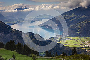 Aerial view of Swiss Alps and Lake Thun at dramatic sunset, Interlaken