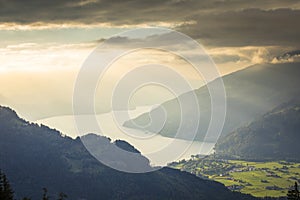 Aerial view of Swiss Alps and Lake Thun at dramatic sunset, Interlaken