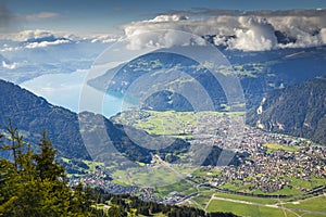 Aerial view of Swiss Alps and Lake Thun at dramatic sunset, Interlaken