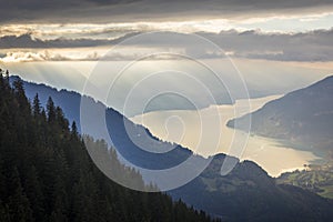 Aerial view of Swiss Alps and Lake Thun at dramatic sunset, Interlaken