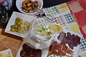 Aerial view of the table with vermouth and some things to snack