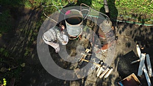 Aerial view of taking liquor samples in laboratory graduated cylinder