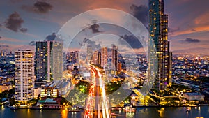 Aerial view of Taksin Bridge with Chao Phraya River, Bangkok Downtown, Thailand, Financial district and business center skylind