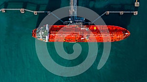 Aerial view tanker ship vessel unloading at port, Business import export oil and gas petrochemical with tanker ship transportation