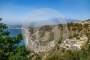 Aerial view of Taormina city, mediterranean sea and Mount Etna Volcano - Taormina, Sicily, Italy