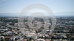 Aerial view of Taubate, with the mantiqueira mountain range in the background, on a sunny afternoon in winter