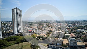 Aerial view of Taubate, with the mantiqueira mountain range in the background, on a sunny afternoon in winter