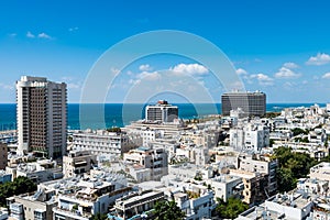 Aerial view of Tel Aviv City with modern skylines and luxury hotels against blue sky at the beach near the Tel Aviv port in Israel