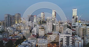 Aerial view of Tel aviv skyline. Urban landscape at sunset evening with skyscraper view and Sea water in horizon