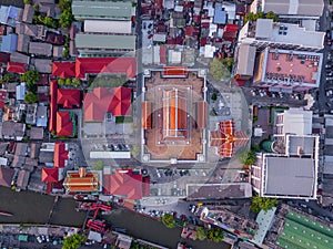 Aerial view of temple, Wat Devaraj Kunchorn Worawihan, Thai architectures. Close up of red roofs. Top view