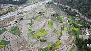 Aerial view of the terraced fields on a hillside farming community in Nepal