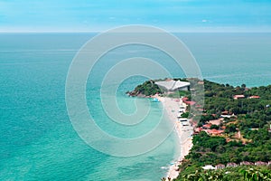 Aerial view from Thailand Koh Larn overlooking the community and the beaches with the sea during the day time amide the blue sk photo