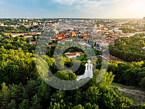 Aerial view of the Three Crosses monument overlooking Vilnius Old Town on sunset. Vilnius landscape from the Hill of Three Crosses