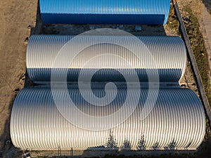 Aerial view of the three round storage rooms of the hangars on a